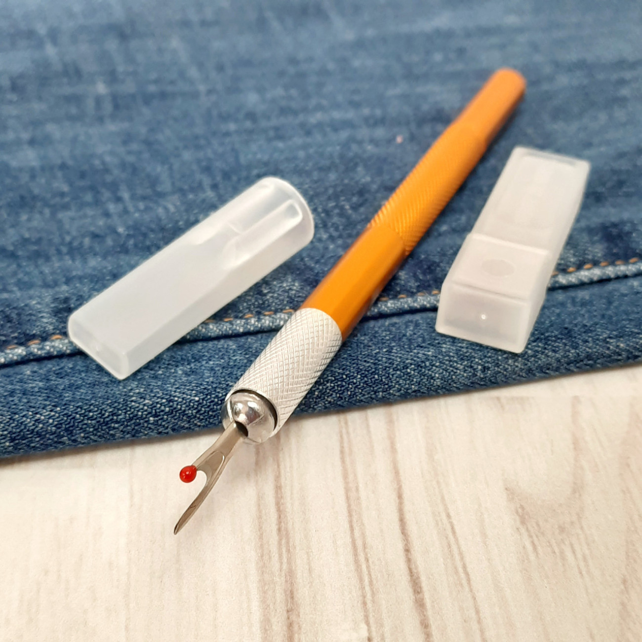 Розпорювач металевий зі змінними лезами (помаранчевий)