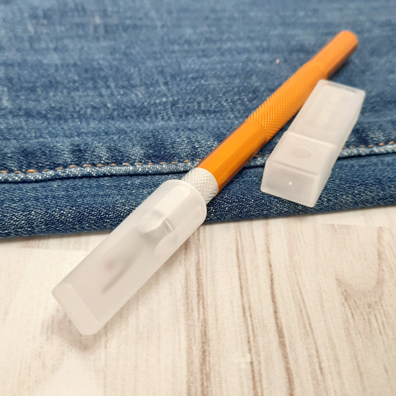 Розпорювач металевий зі змінними лезами (помаранчевий)