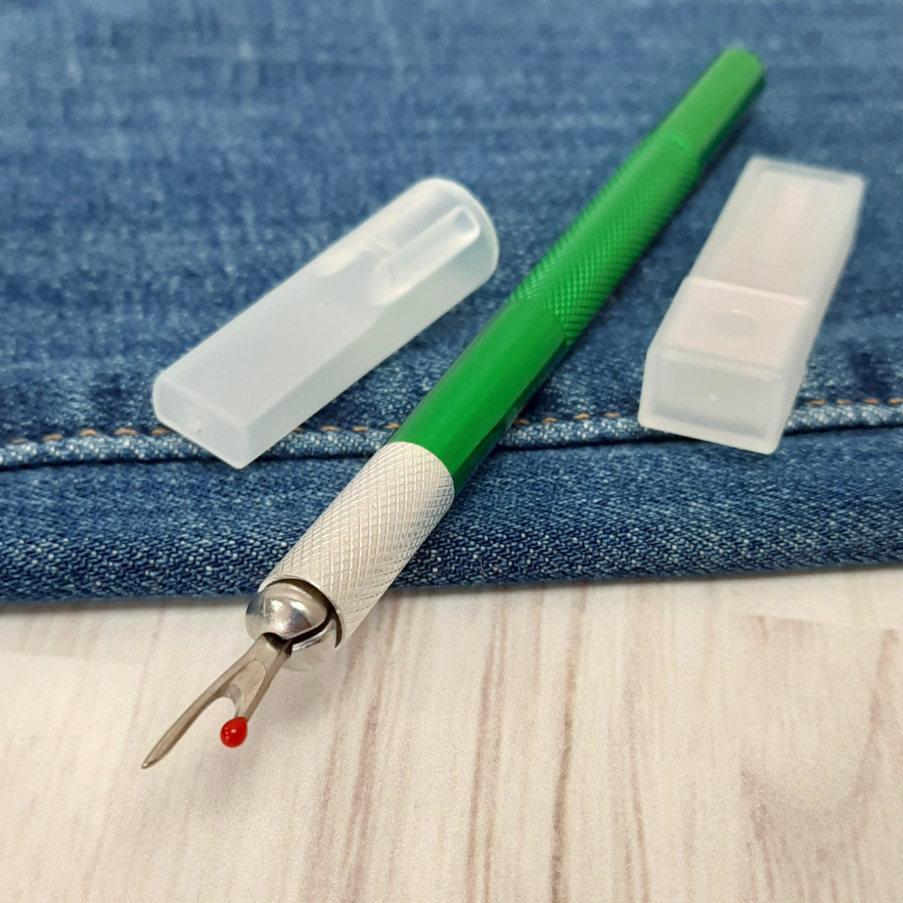 Розпорювач металевий зі змінними лезами (зелений)