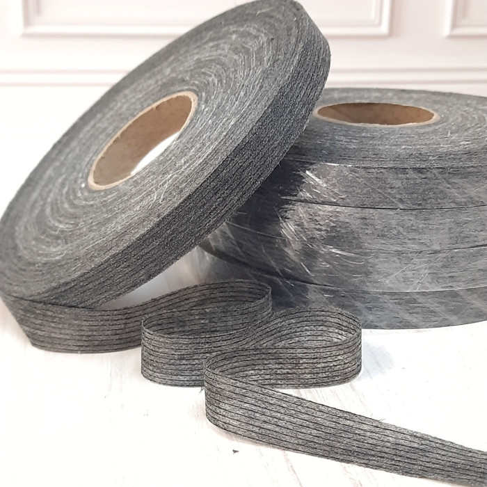 Тасьма ниткопрошивна клейова дольова, 15 мм, сіра ,моток 100м