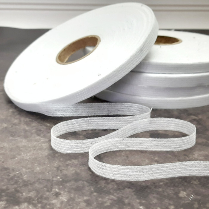 Тасьма ниткопрошивна клейова дольова, 10 мм, біла ,моток 100м