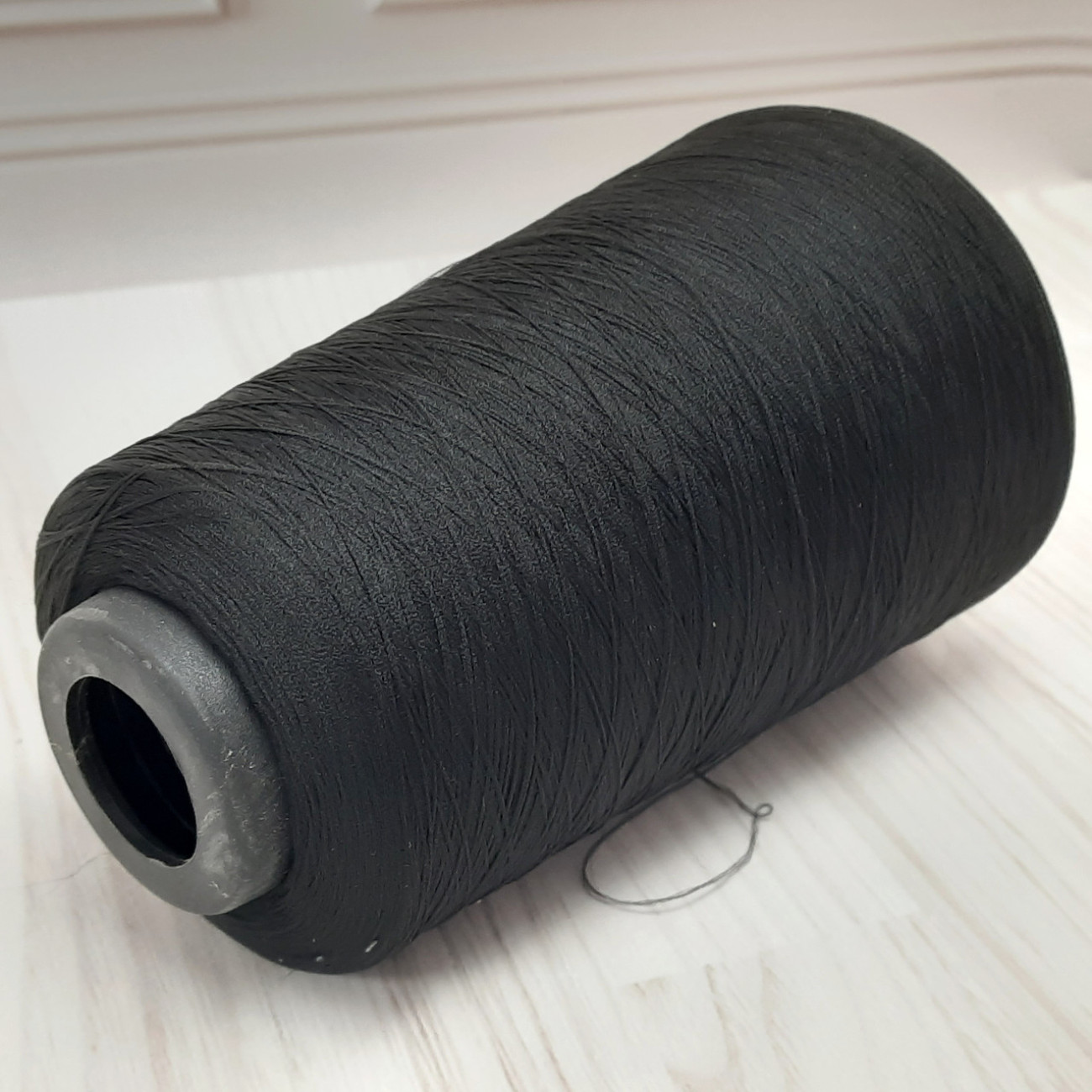 Текстуровані нитки для оверлока 150D/1, чорні