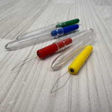 Нитковтягувач з прозорим ковпачком