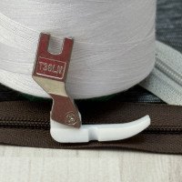 Лапка T36LN фторопластова лівостороння вузька для вшивання блискавки для промислових швейних машин