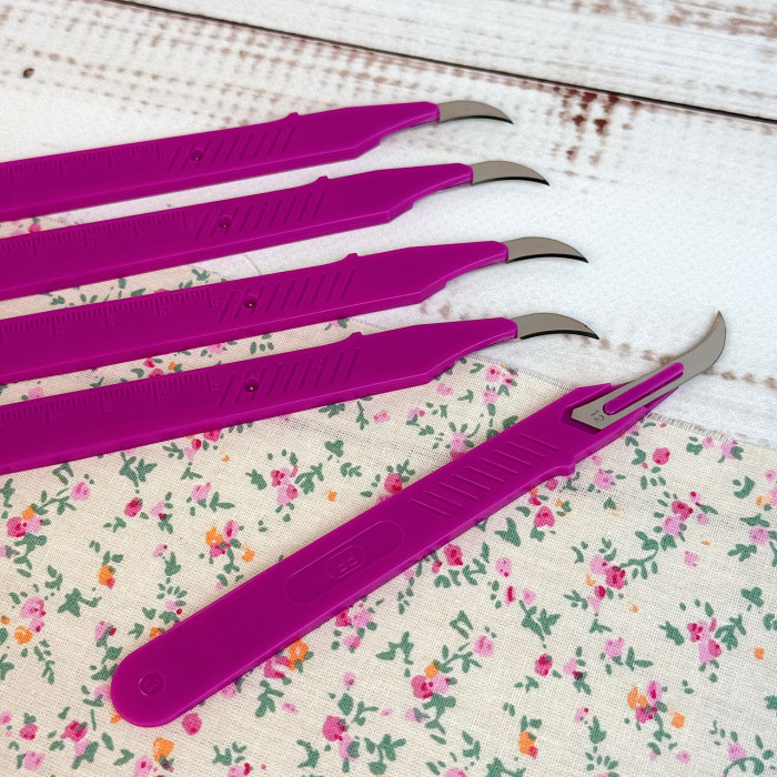 Розпорювач швів вигнутий фуксія
