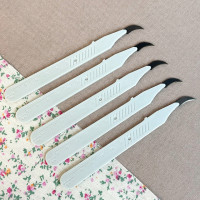 Розпорювач швів вигнутий молочний