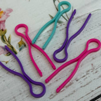 Фіксатори для шпульок пластикові