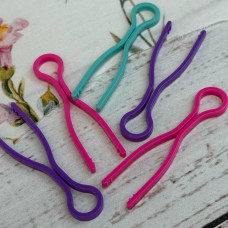 Фіксатори для шпульок пластикові