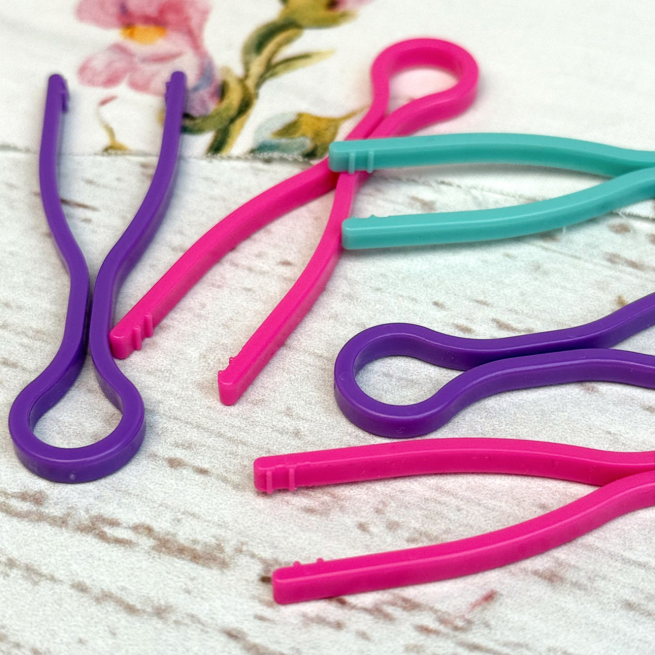 Фіксатори для шпульок пластикові