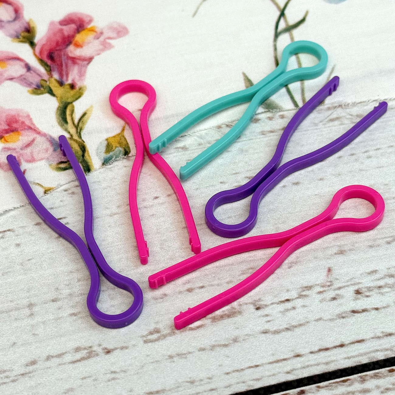 Фіксатори для шпульок пластикові