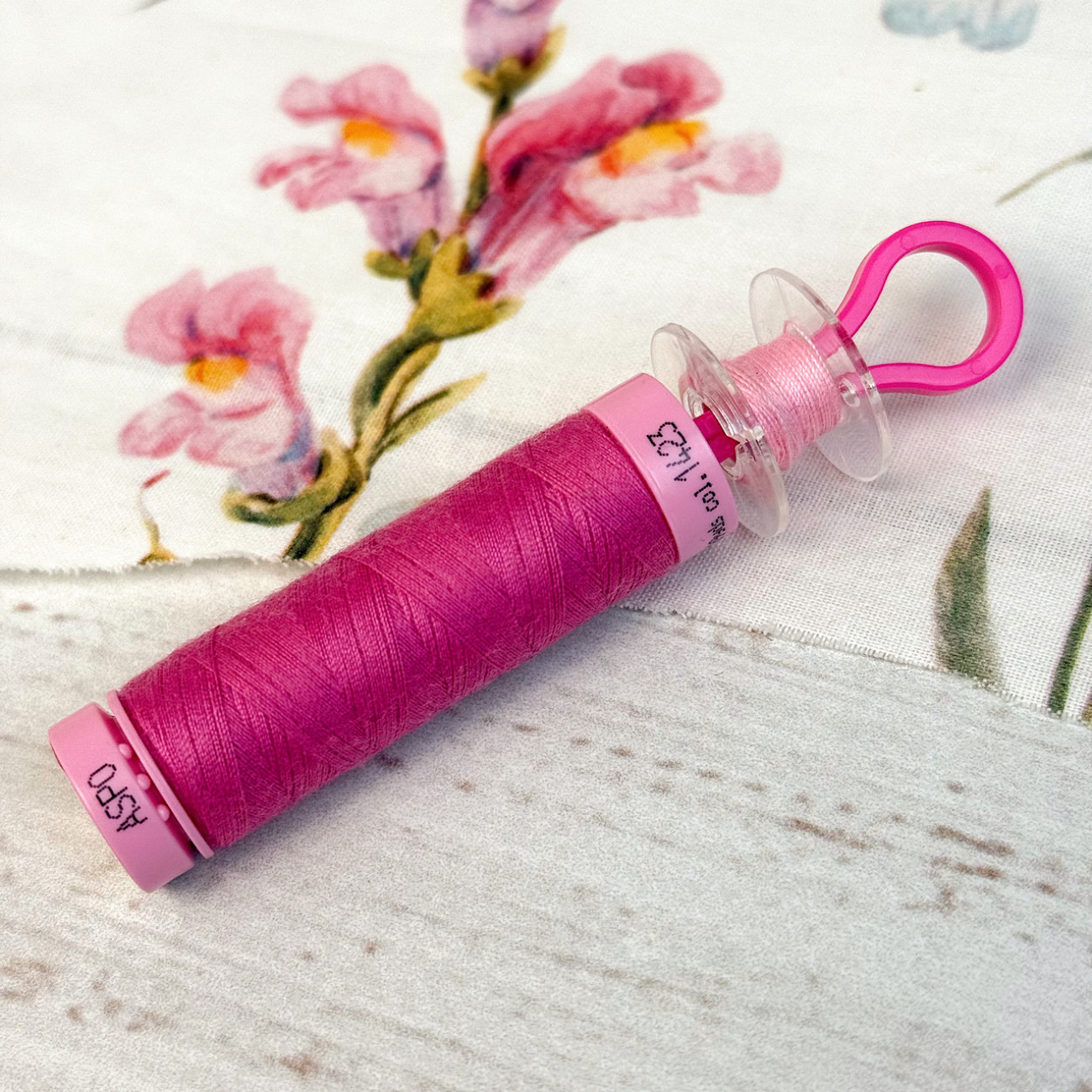 Фіксатори для шпульок пластикові