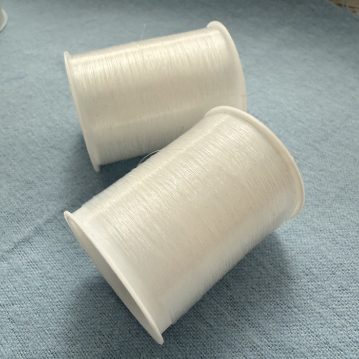 Мононитка біла, котушка