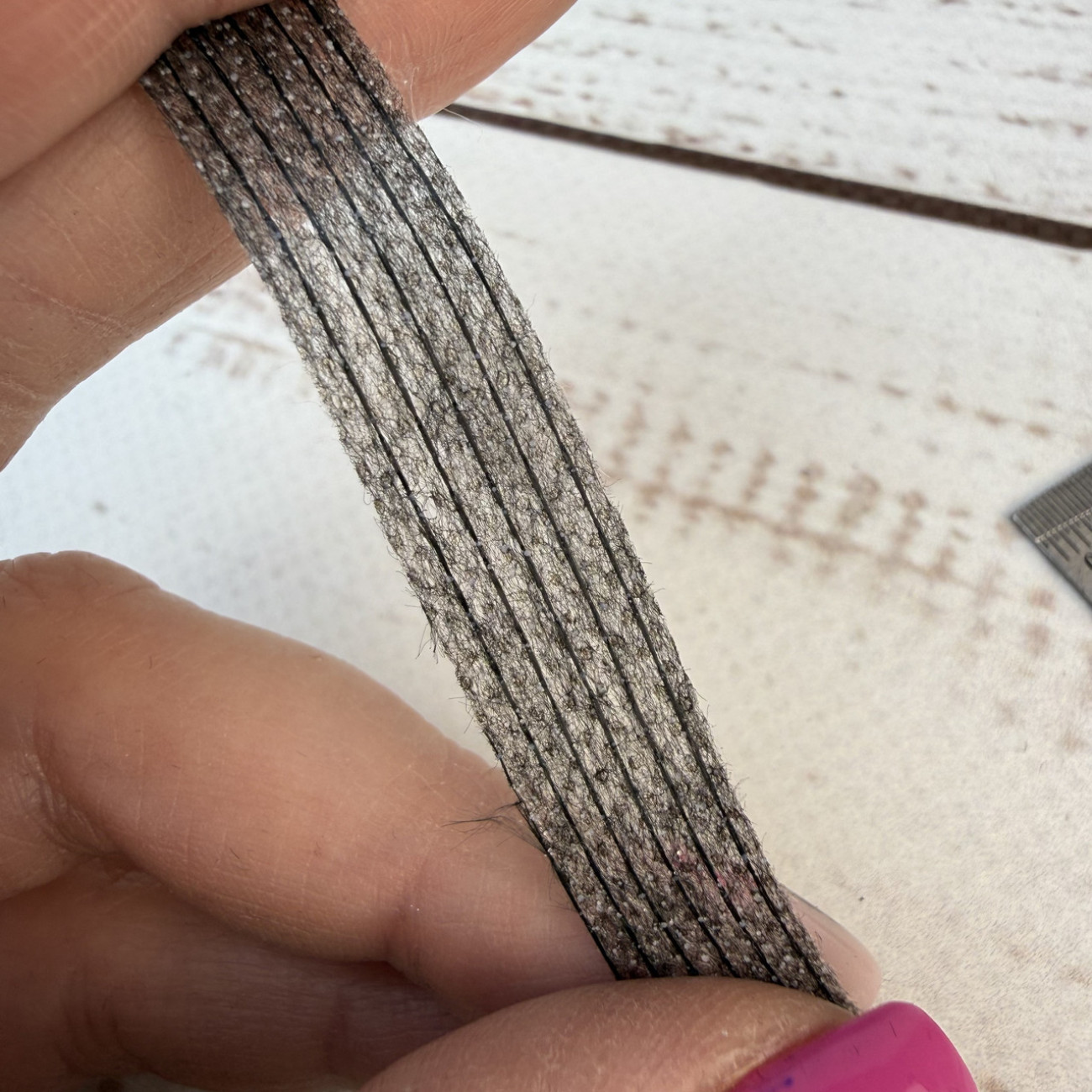 Тасьма ниткопрошивна клейова дольова, 10 мм, сіра, моток  100м