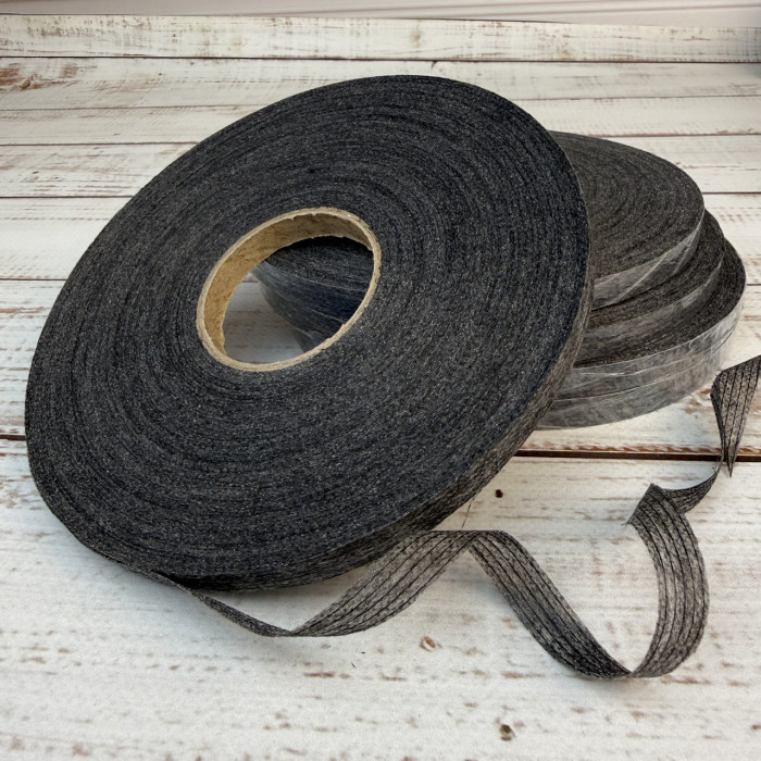 Тасьма ниткопрошивна клейова дольова, 10 мм, сіра, моток  100м